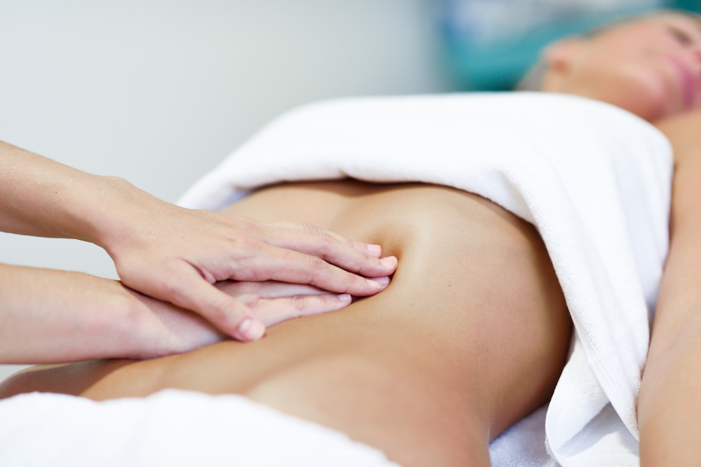 houston plastic surgery model receiving abdominal massage