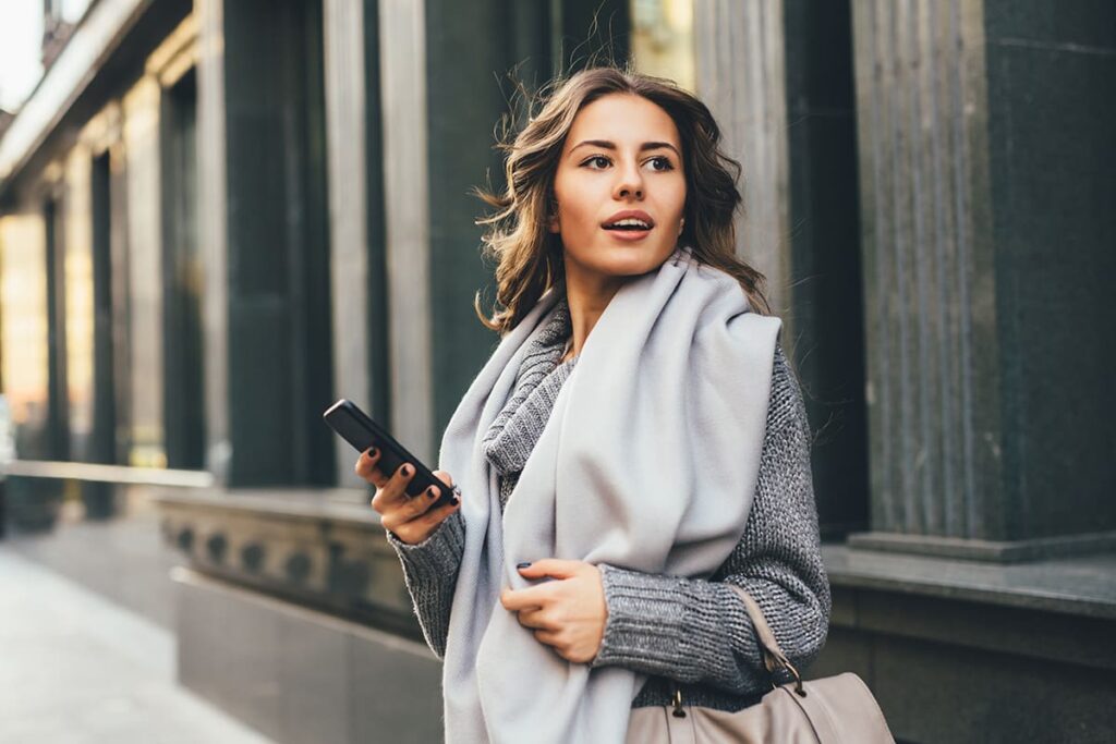 houston plastic surgery model wearing a gray scarf